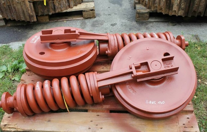 Натяжители гусеничных цепей экскаваторов и бульдозеров